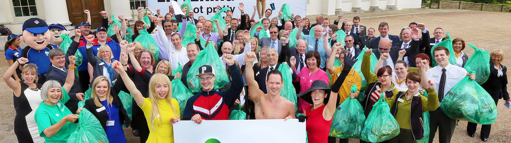 A large group of people outside supporting an anti littering initiative 