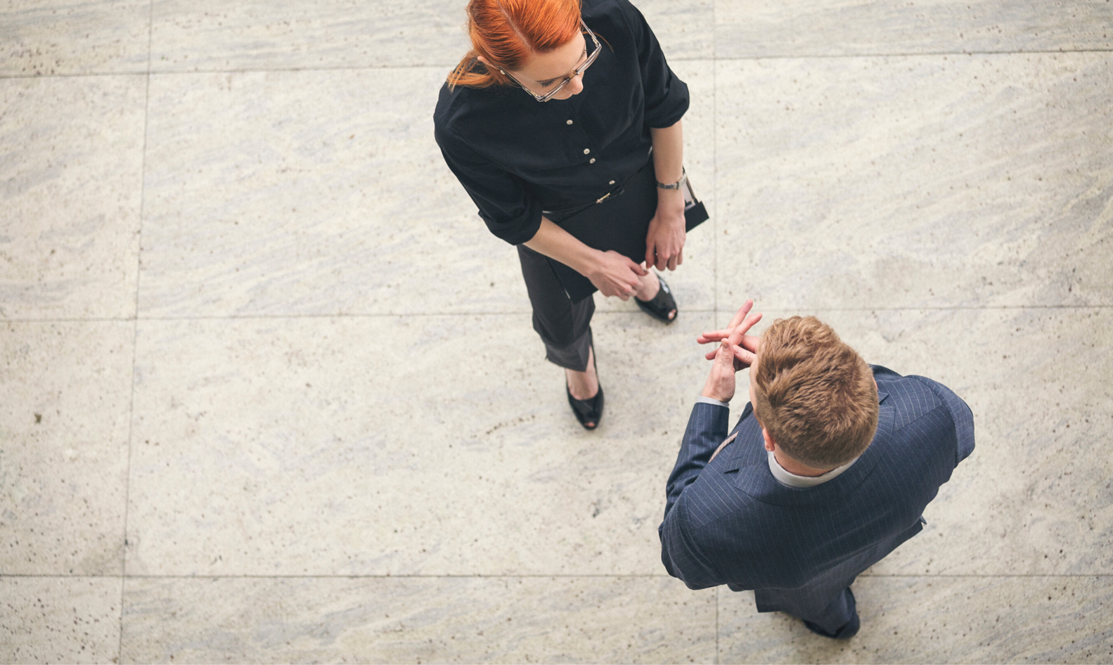 Two people who are deep in conversation, viewed from above