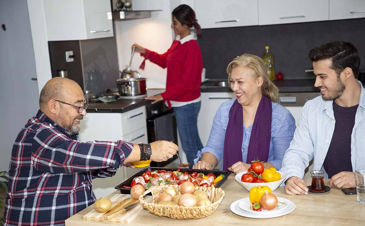 Photo of a family preparing food