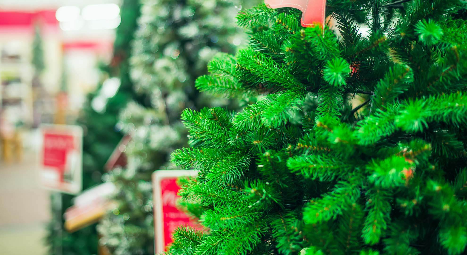 An artificial christmas tree in a store