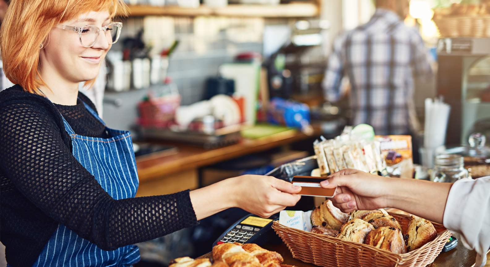 A person taking a payment card during a transaction