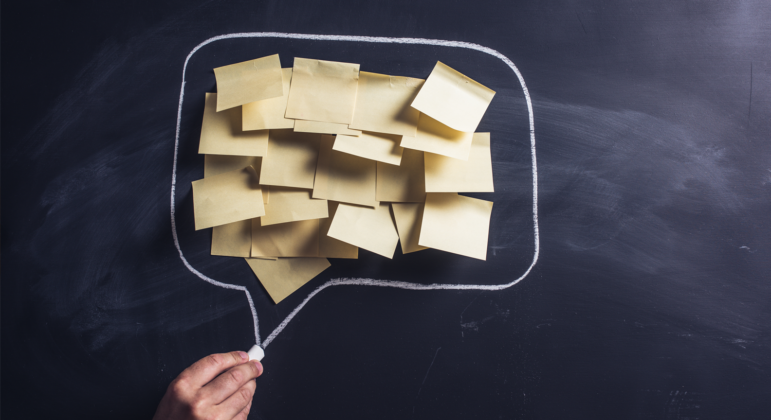 A hand drawn speech bubble containing post it notes