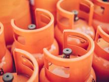 A group of orange gas canisters 