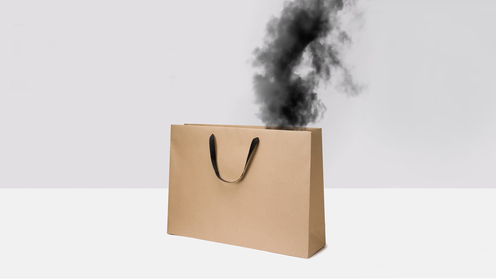 Image of a shopping bag with black smoke pouring out of it