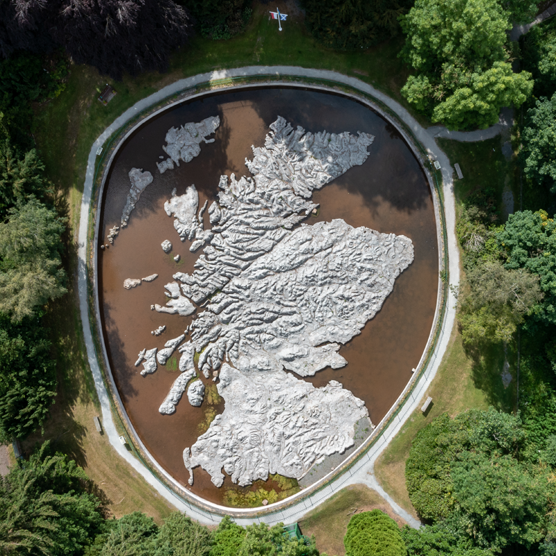 A map of Scotland inside a small water feature