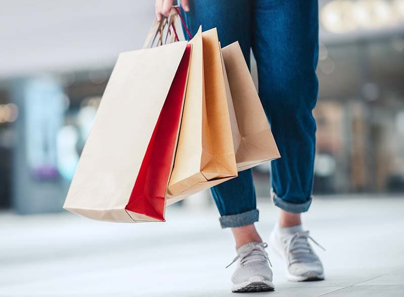 A person holding shopping bags