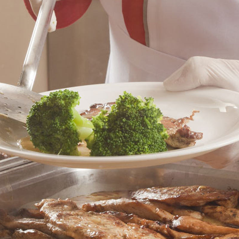 A chef preparing food in a kitchen