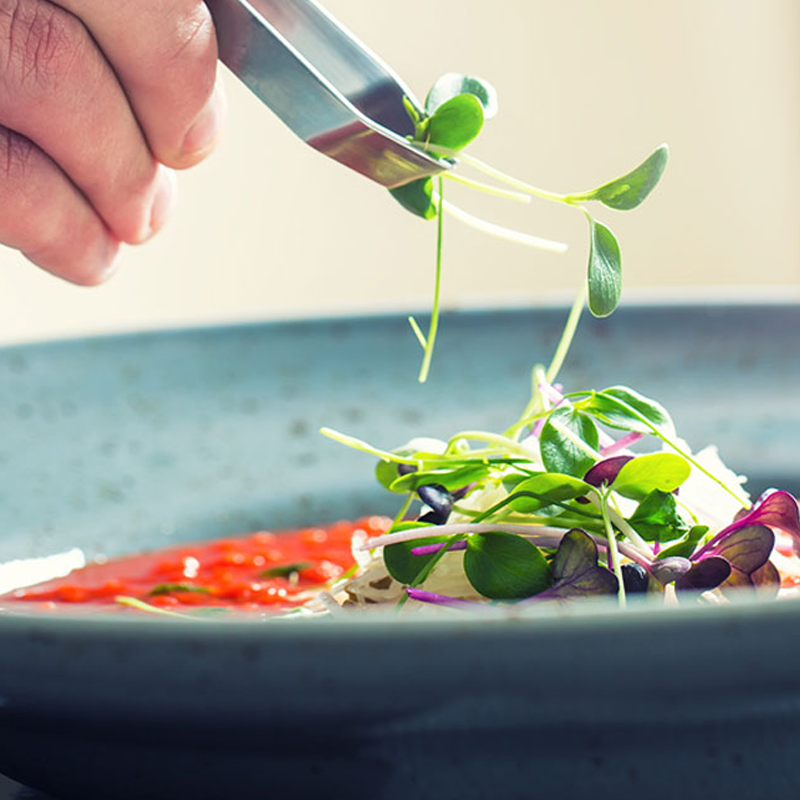 A chef preparing food in a kitchen