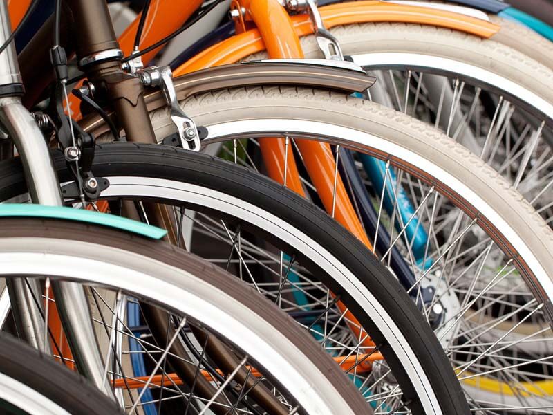 A row of different bike wheels