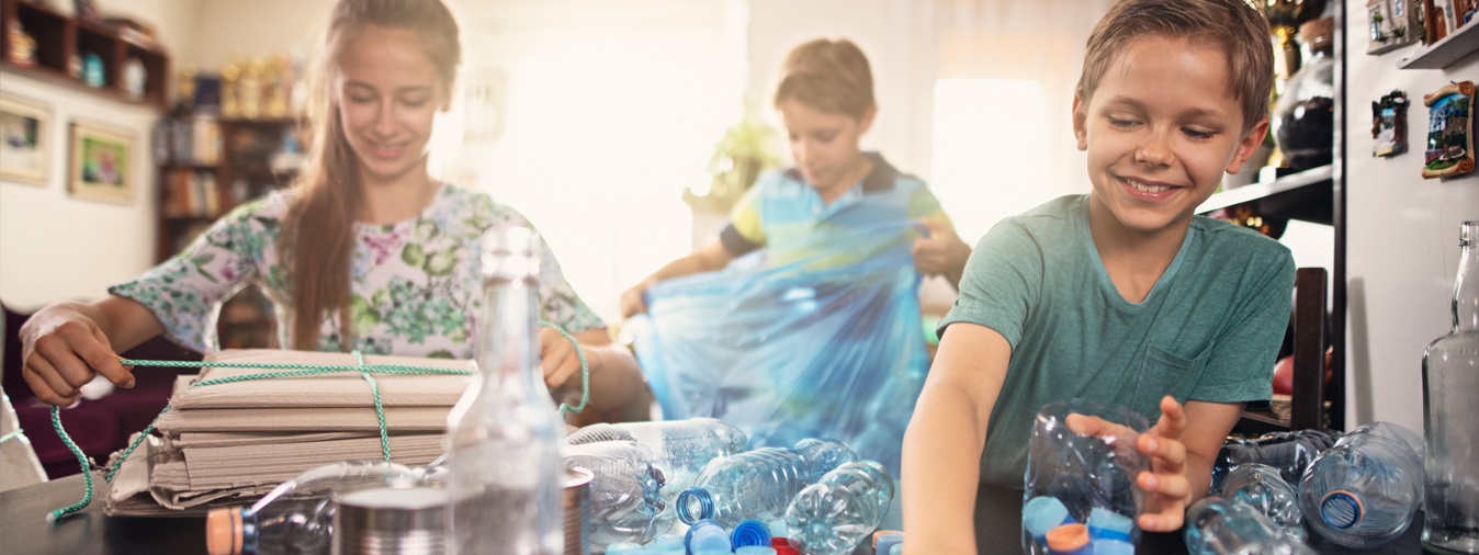 A group of young people sorting recycling