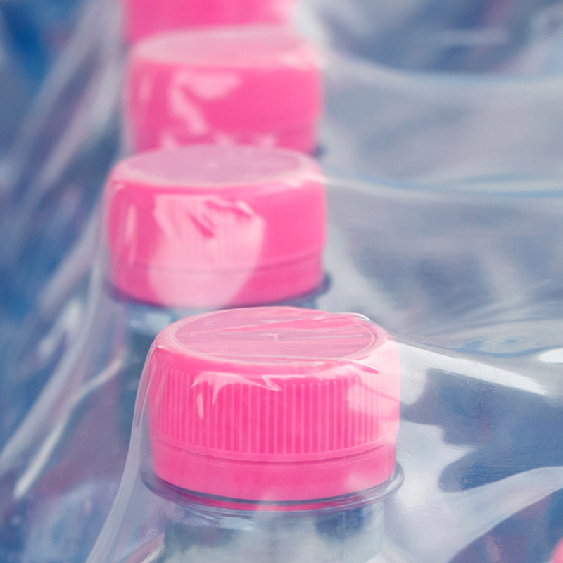 Plastic water bottles wrapped in plastic film