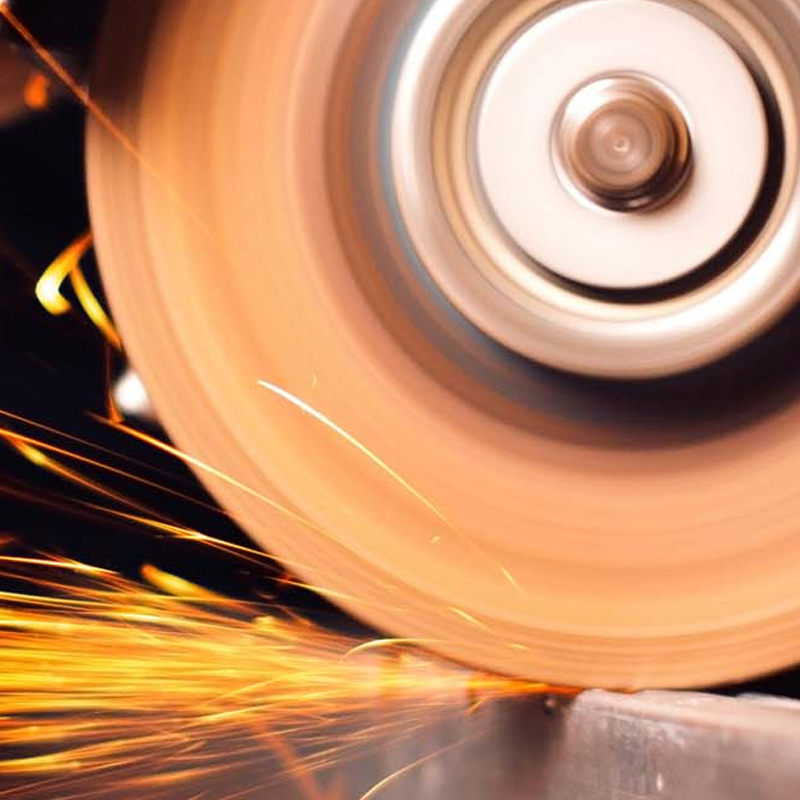 Grinder shaping metal with sparks 