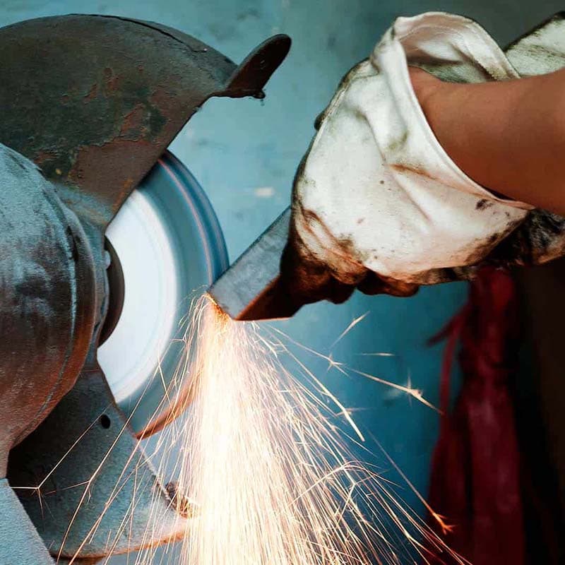 Photo of a person using an angle grinder