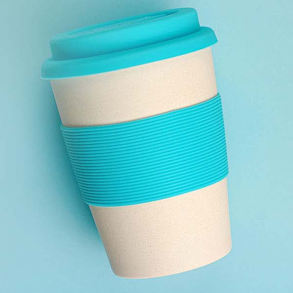 Photo of a reusable cup on a light blue background